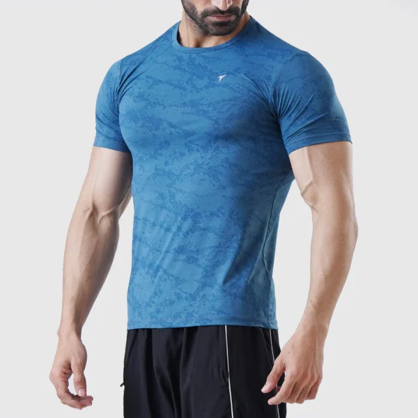 Blue compression/athletic shirt – similar gym wear in another color.